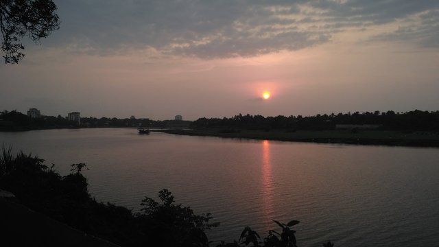 Reddish sunset view for river shore
