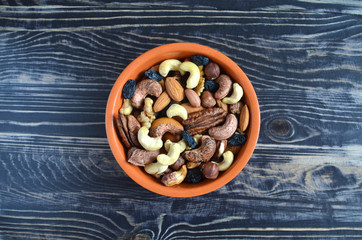 Nuts in brown dishes on a wooden table