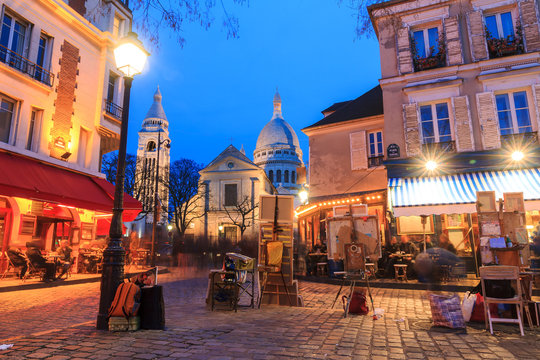 Beautiful evening view of the Place du Tertre and the Sacre-Coeur in Paris, France
