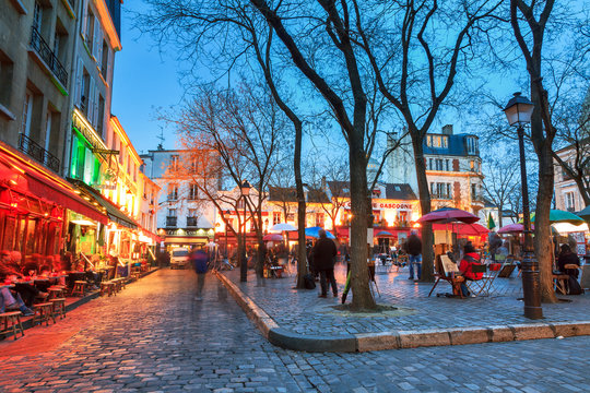 Beautiful evening view of the Place du Tertre and the Sacre-Coeur in Paris, France
