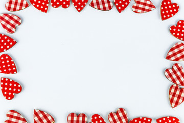 Obraz premium frame with hearts isolated on white