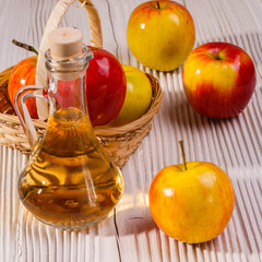 apple vinegar on a wooden rustic background