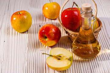 apple vinegar on a wooden rustic background