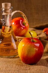 apple vinegar on a wooden rustic background