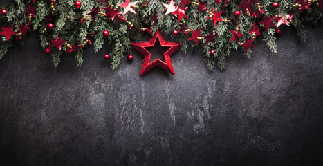 Christmas Decoration With Fir Branches and Red Berries On a Dark Background