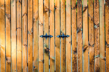 Wooden board background with metal handles.