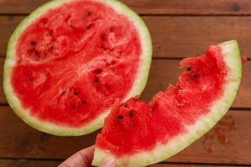food outside - red watermelon on wood table on summer time