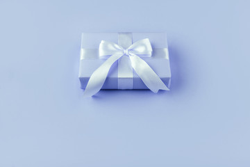 Gift or present box on blue