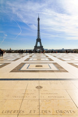 Beautiful Eiffel tower seen from Trocadero square with a blue cloudy sky in winter
