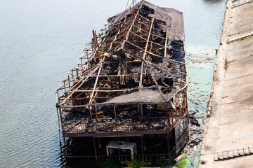 Burned ship in the water
