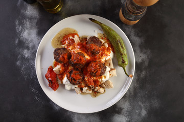 meatball with tomato sauce on a bread 