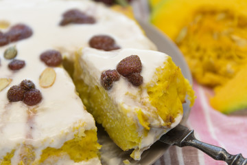 Pumpkin homemade cheesecake with white cream. Autumn still life. Thanksgiving day food.