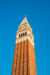 Fototapeta na wymiar San Marco campanile, bell tower of Saint Mark cathedral on square in Venice