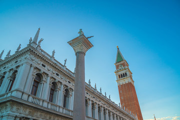 Fototapeta na wymiar San Marco campanile, bell tower of Saint Mark cathedral on square in Venice