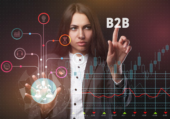 The concept of business, technology, the Internet and the network. A young entrepreneur working on a virtual screen of the future and sees the inscription: B2B