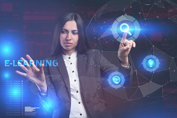 The concept of business, technology, the Internet and the network. A young entrepreneur working on a virtual screen of the future and sees the inscription: E-learning