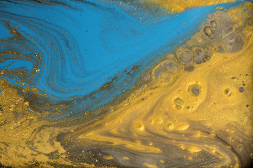 Gold marbling texture design. Blue and golden marble pattern. Fluid art.