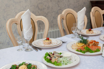 snacks, tartlets with various fillings on white table