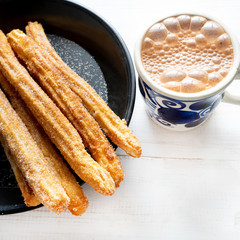 Churros with sugar and chocolate
