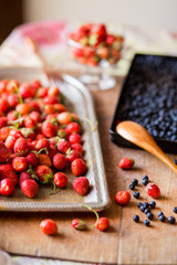 Close-up of strawberries and blueberries on a wooden Board. Breakfast, summer, cottage