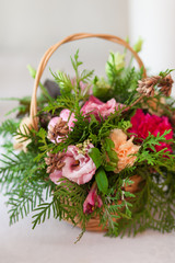 Obraz na płótnie Canvas Beautiful bouquet of bright flowers with green leaf in basket