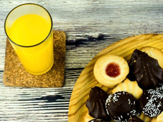 Orange juice and different types of cookies
