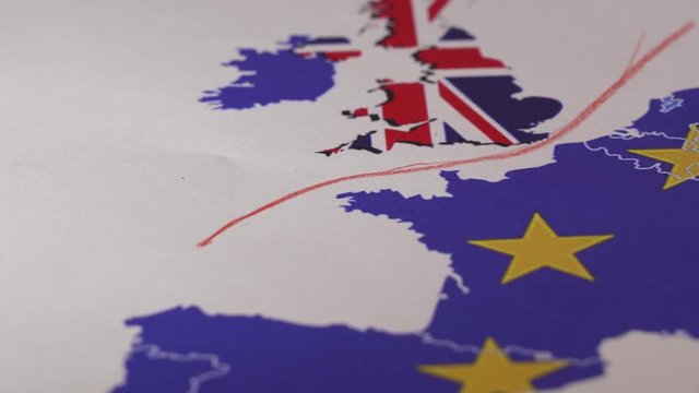 Hand drawing a red line between the UK and the rest of the European Union. Concept of Brexit. The UK is thus on course to leave the EU on 29 March 2019