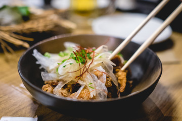 Traditional dinner of seafood with vegetables and chopsticks at a Tokyo restaurant