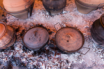 cooking in clay pots in hot coal