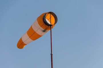 large wind direction indicator and blue sky