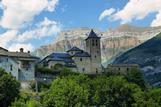 Torla Ordesa, church with the mountains at bottom, Pyrenees Spain