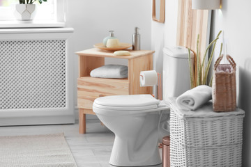 Toilet bowl in modern bathroom interior