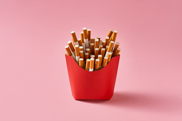 Many cigarettes in red carton, isolated studio shoot.