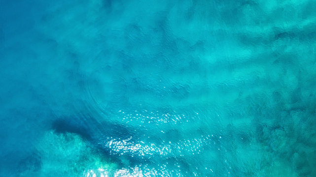 Fototapeta Aerial view at the sea. Turquoise water from air as a background from air. Natural seascape at the summer time. Seascape from drone