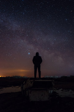 Man on the background of the milky way