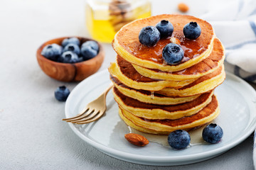Classic american pancakes with fresh berry and honey.