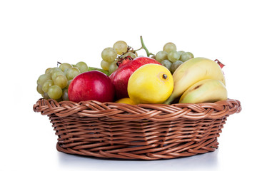 pomegranates and other fruit in the basket