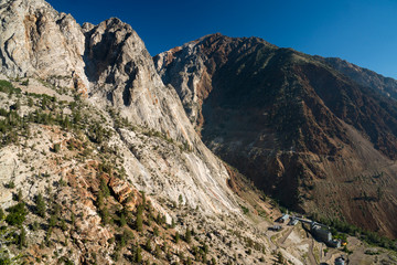 Dry dusty trail zig zagging up a desert mountain in California