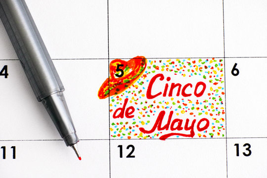 Reminder Cinco de Mayo in calendar with pen.