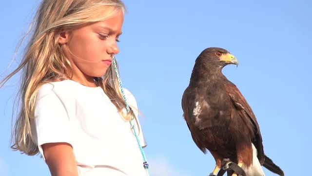 Blond girl blue eyes together hawk eagle.