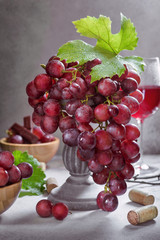 Ripe grape bunch  with leaves and glass of wine. Still life concept - 221863230