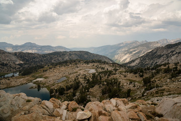 Fototapeta premium Wide granite valleys at sunset in California's Sierra Nevada along the John Muir Trail