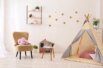 Cozy kids room interior with play tent and toys