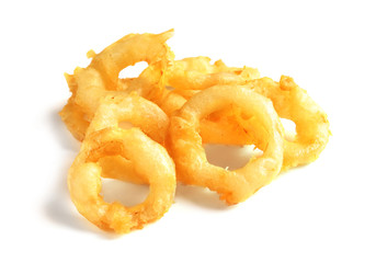Delicious golden breaded and deep fried crispy onion rings on white background