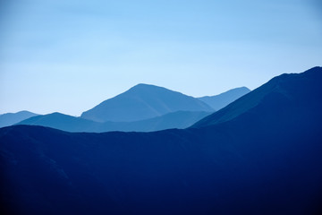mountain top panorama in  autumn covered in mist or clouds