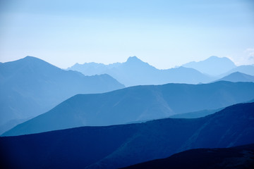 mountain top panorama in  autumn covered in mist or clouds