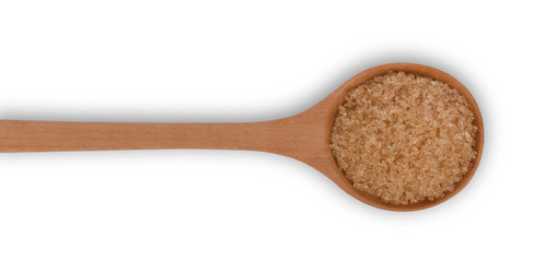 bown sugar on wooden spoon on white background