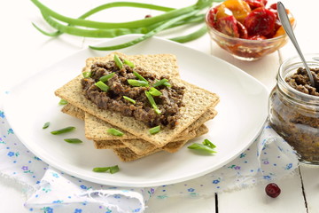 Mushroom pate and dried tomatoes with crackers, mousse