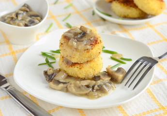 Fried potato cutlets /patties/ with mushroom sauce