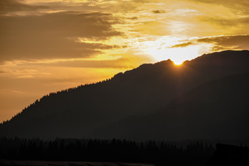 panoramic view of misty forest in western carpathian mountains. Tatra in foggy sunset